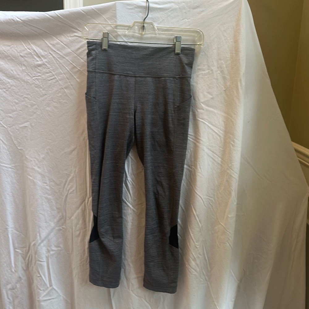 Grey and Black Lululemon 7/8 Leggings with Side Pockets and Calf Mesh Cutouts